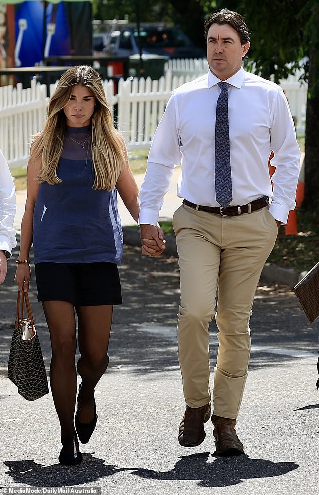 Matt Wright arrives at court wearing a shirt and tie alongside his wife Kaia Wright