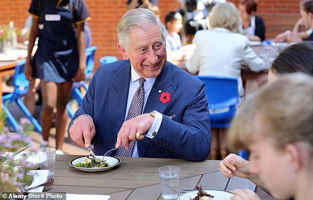 King Charles III tucking into a salad while on a royal tour of Australia. Charles allegedly brings his own organic food taken with him when he visits friends