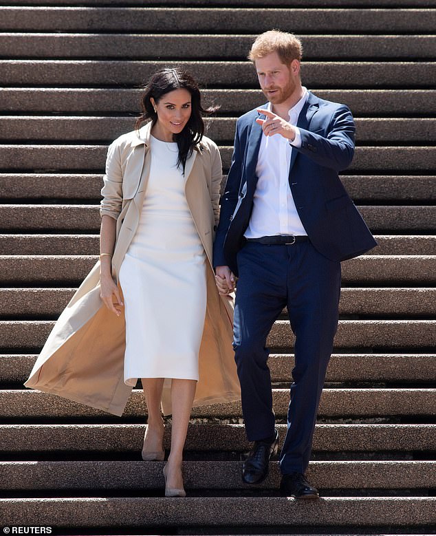 Harry and Meghan on the steps of the Sydney Opera House in October 2018
