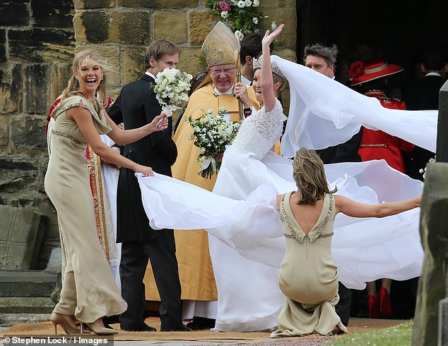 Bridesmaid Chelsy Davy - a former flame of Prince Harry - is pictured at the wedding of Lady Melissa Percy and Thomas van Straubenzee