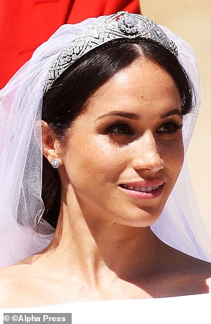 Meghan is pictured on her wedding day to Prince Harry