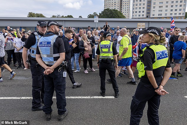 A large police presence separated two rival protests from those opposed to the asylum hotel and anti-racist demonstrators in Falkirk yesterday