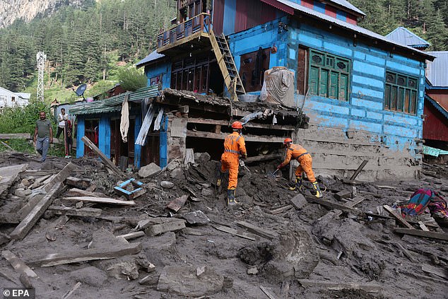 Flash floods across northern Pakistan and India-controlled Kashmir have killed at least 344 people in the past 48 hours, local authorities said on Saturday. Pictured: National Disaster Response Force (NDRF) members search for missing people in the cloudburst-hit village of Chisoti