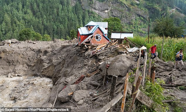Damaged houses are pictured at the site of a flash flood in a mountain village in the Himalaya region of Kishtwar district, on august 15, 2025