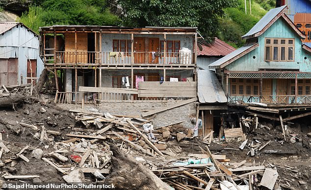 Damaged houses are pictured at the site of a flash flood in a mountain village in the Himalaya region of Kishtwar district, on august 15, 2025