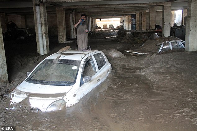 Vehicles trapped in mud in the aftermath of flash floods in Swat, Pakistan, 16 August 2025