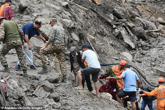 Police, Indian Army, NDRF and State Disaster Response Forces rescue and evacuate people near the site of cloudburst in Chositi village in Indian-administered Kishtwar, Jammu and Kashmir on August 15