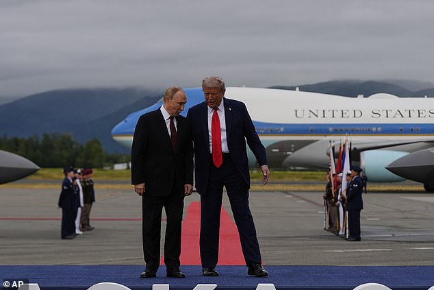 President Donald Trump greets Russia's President Vladimir Putin in Alaska on Friday