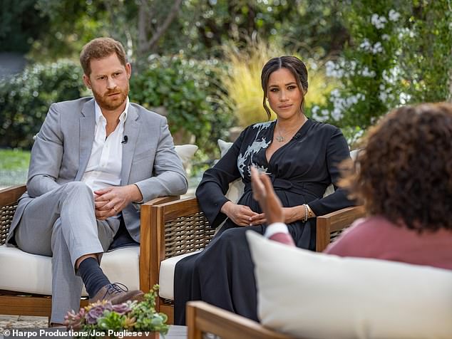 Prince Harry and Meghan Markle during their interview with Oprah Winfrey. Royal author Tom Quinn claims the interview was an example of how Meghan 'aired grievances' without her statements being 'challenged'