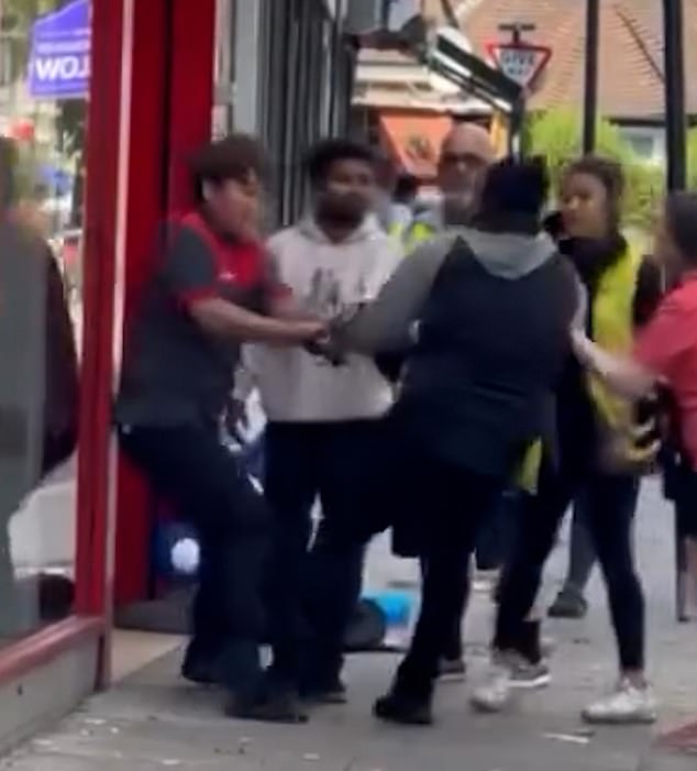 A heroic passerby also jumped into the fray and began punching the thief and helping to wrestle the bag off the shoplifter alongside the iceland staff member