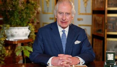 King Charles III sat at his desk in Buckingham Palace. While like to travel with the kitchen sink, the King prefers truck full of his furniture
