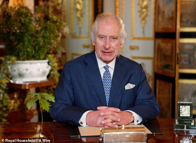 King Charles III sat at his desk in Buckingham Palace. While like to travel with the kitchen sink, the King prefers truck full of his furniture