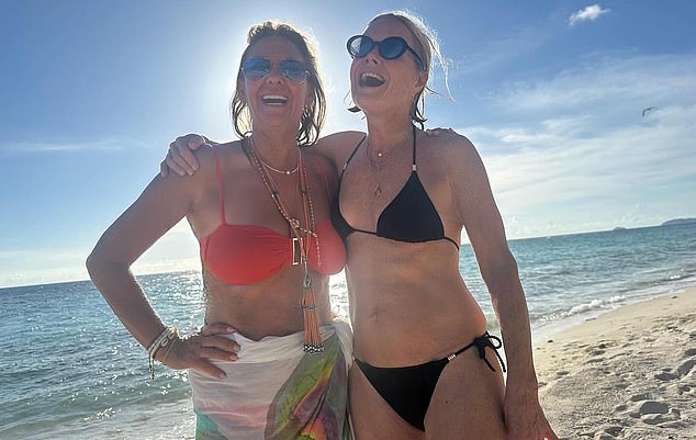 Mariella Frostrup, right, and her friend Fiona Howden, wife of insurance tycoon David Howden, soaking up some sun at the beach