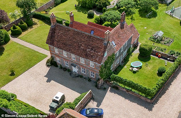 A hippy has been barred from approaching her mother in a dispute over a £3million manor house (pictured), caused by her use of a 'spiritual guru'