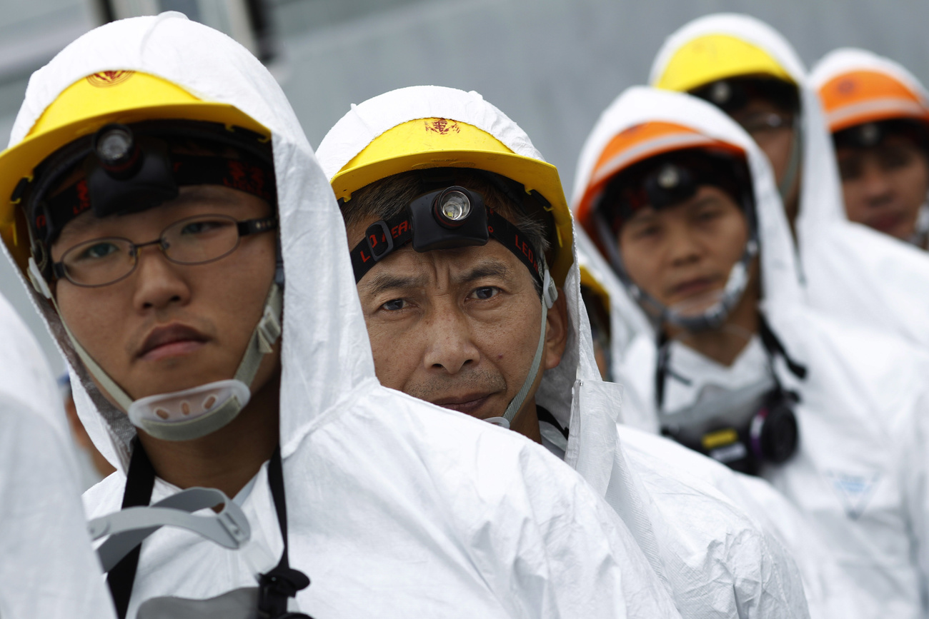 nuclear employees in protective suits