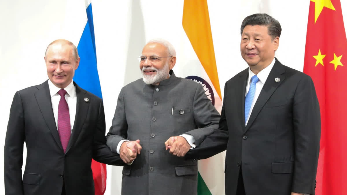Russian President Vladimir Putin, Indian Prime Minister Narendra Modi and Chinese President Xi Jinping hold a meeting on the sidelines of the G20 summit in Osaka on June 28, 2019.