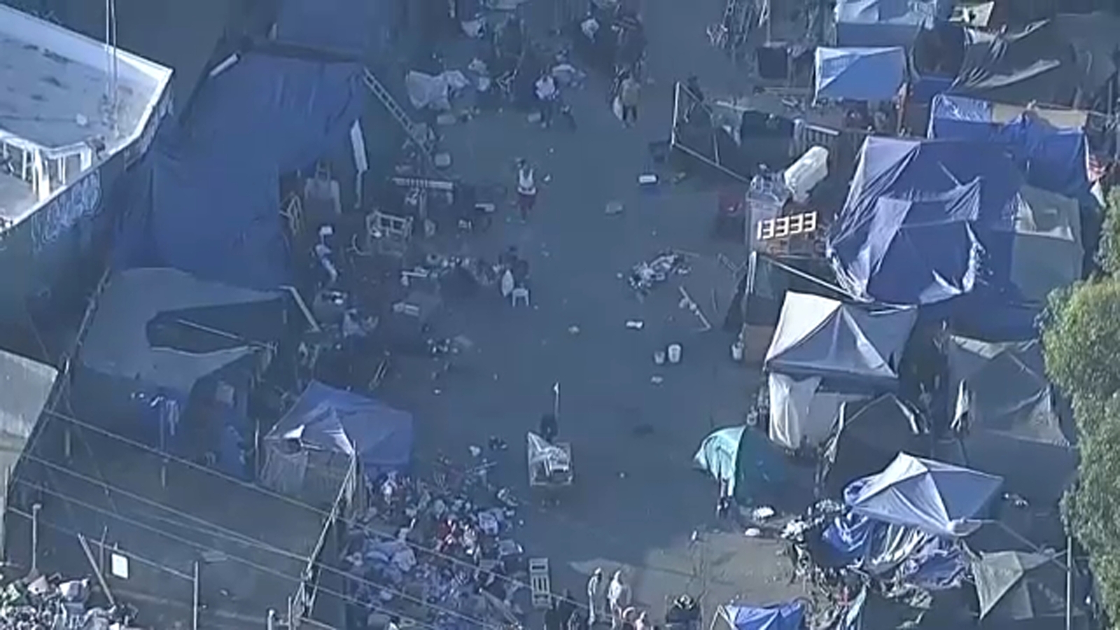 Protesters arrive as 'notorious' homeless encampment in Van Nuys is cleared as part of Los Angeles Inside Safe program