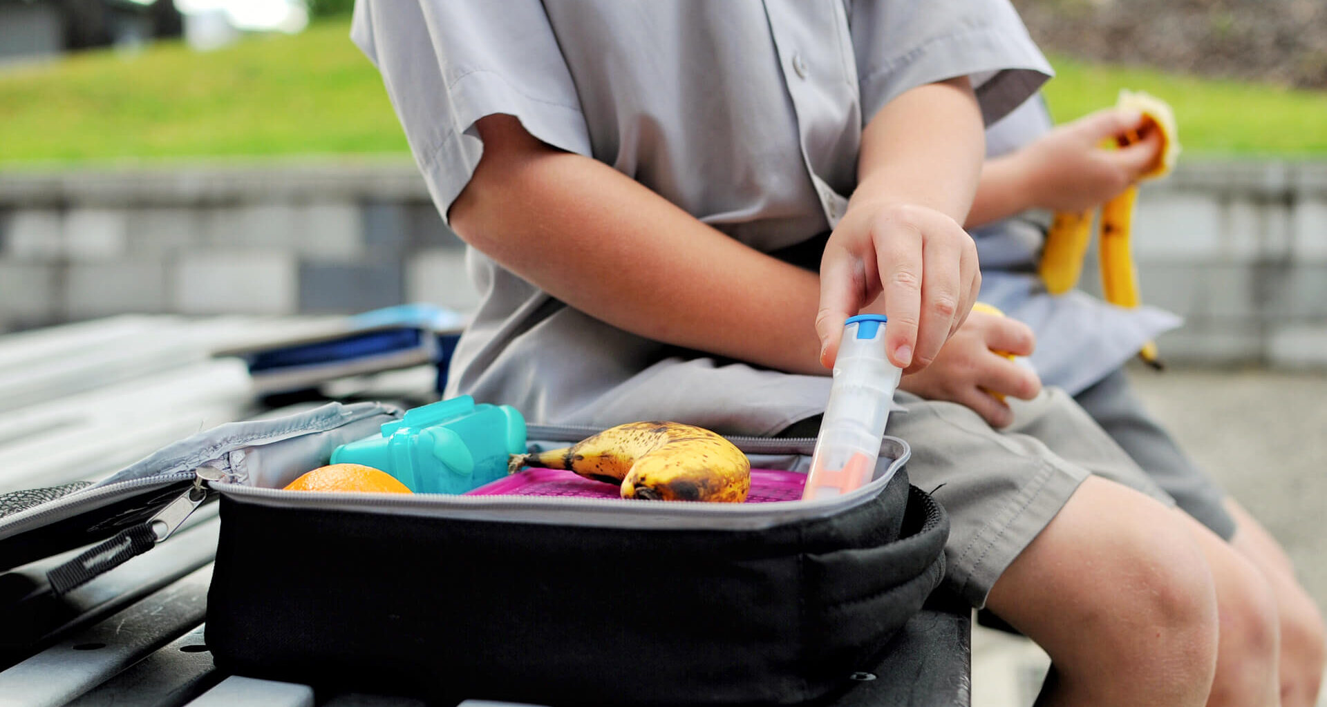 Young boy with a packed lunch