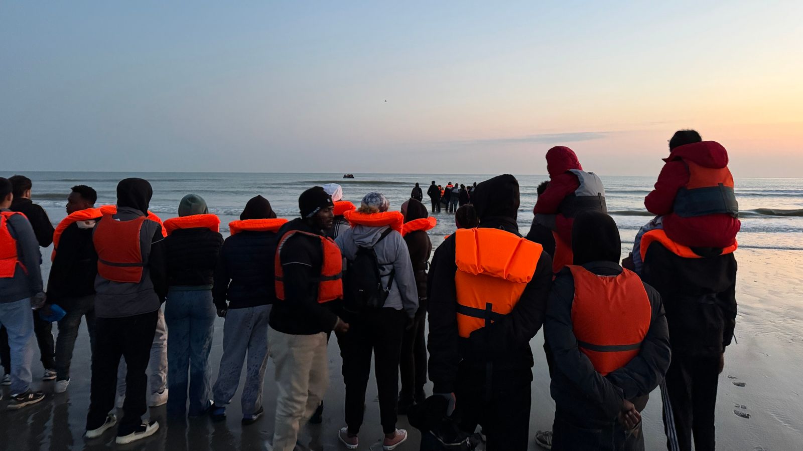 Migrants in Dunkirk, France, preparing to cross the English Channel