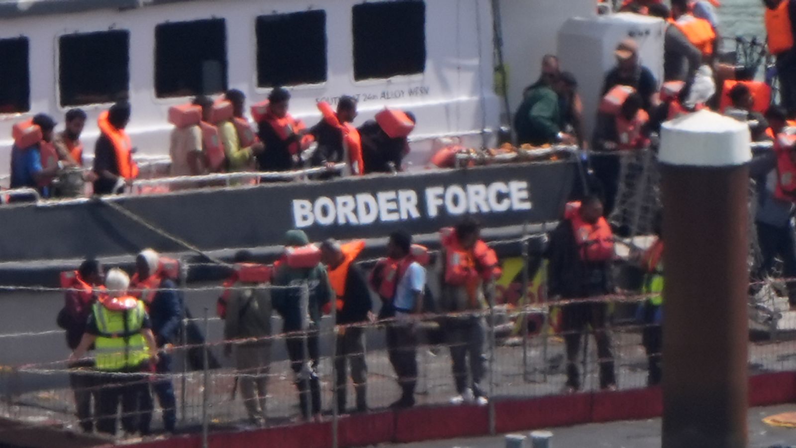 Migrants are brought in to the Border Force compound in Dover, Kent, Pic: PA