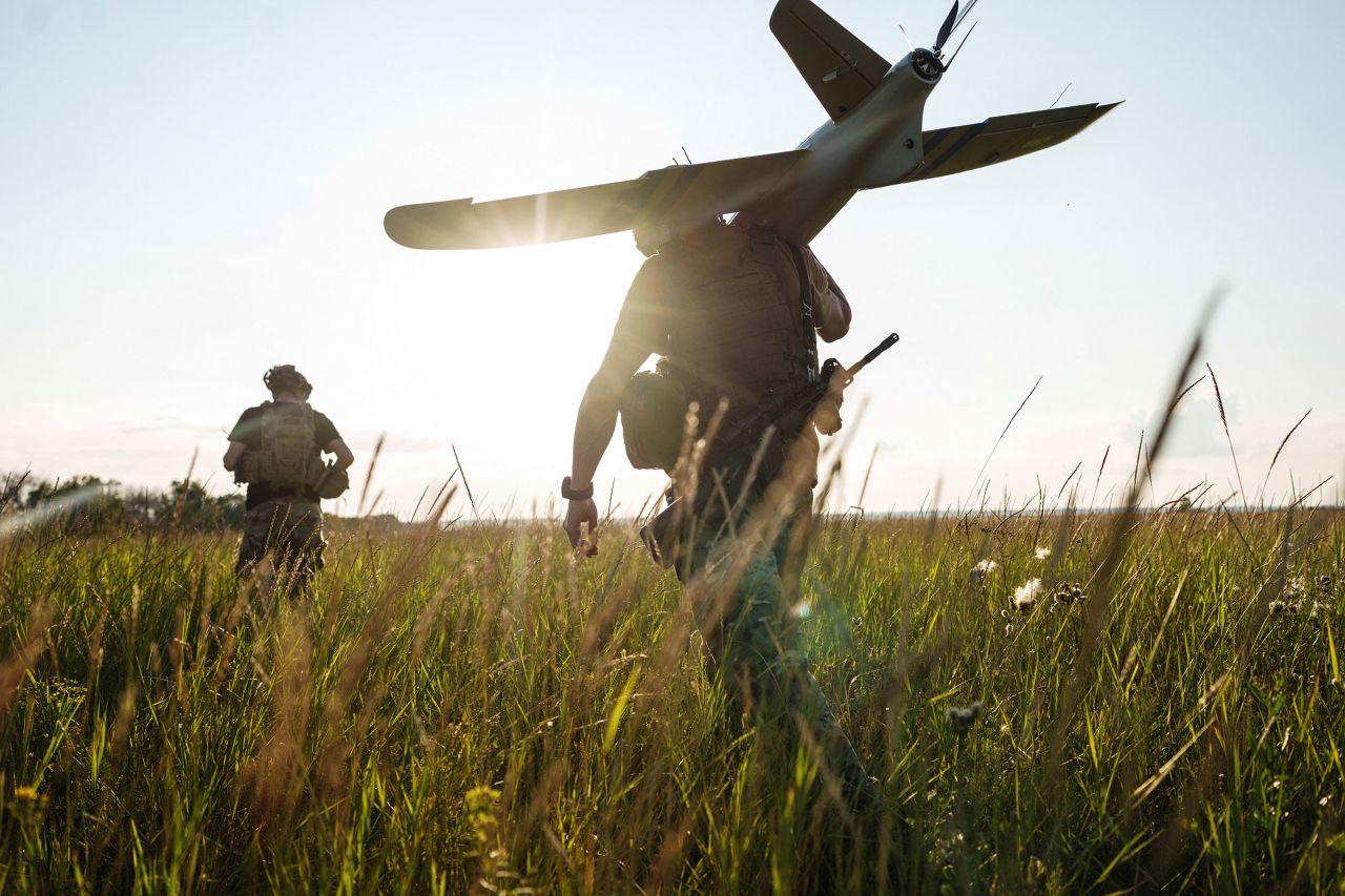 Service members of the 13th Operative Purpose Brigade of the National Guard of Ukraine prepare to launch a Ukrainian-made reconnaissance drone toward a front line in Ukraine's Kharkiv region on July 20.