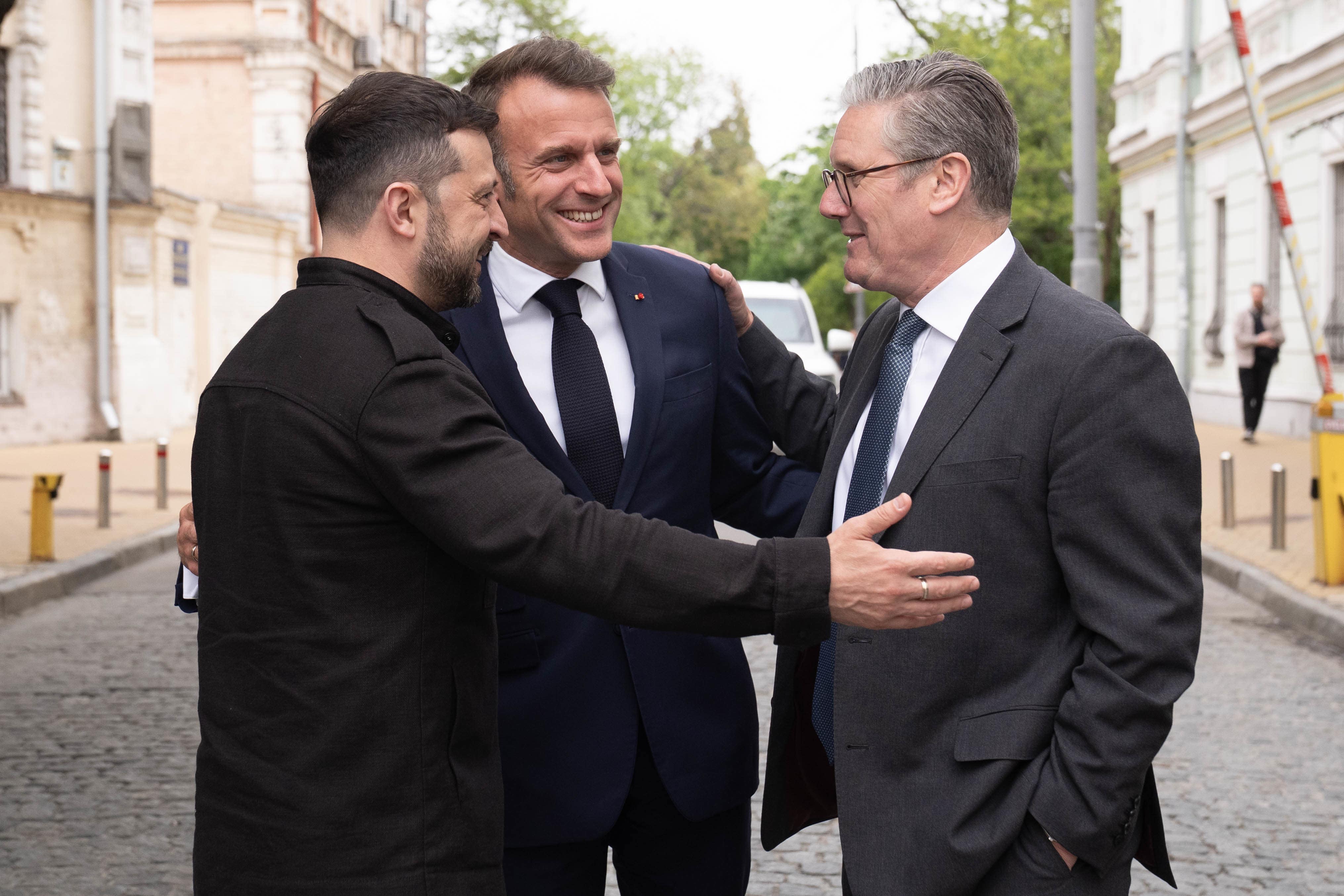 Ukrainian President Volodymyr Zelensky, French President Emmanuel Macron and Prime Minister Sir Keir Starmer tour the streets of Kyiv, Ukraine, after a meeting of the so-called “coalition of the willing” at the Presidential Palace in France earlier this year
