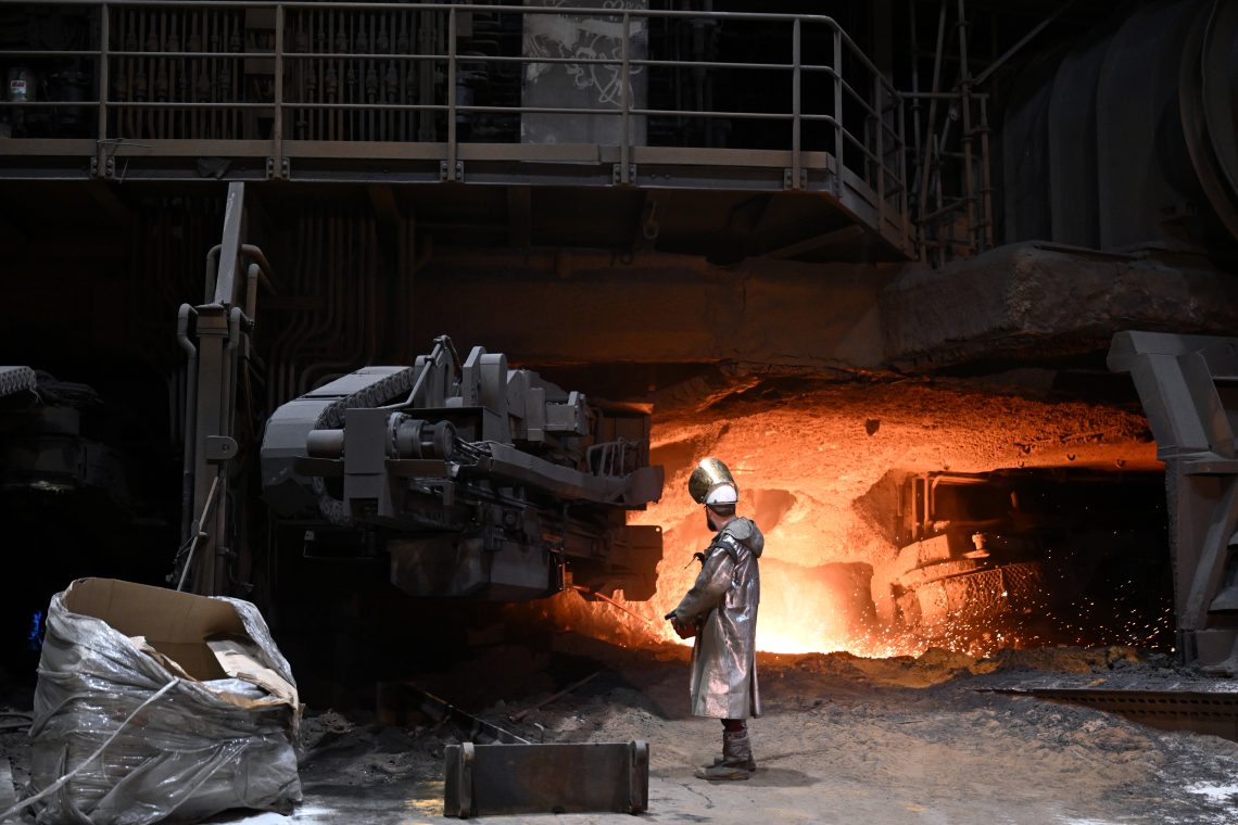 Dec. 10, 2024: A steelworker stands beside a blast furnace. In November, ThyssenKrupp Steel Europe, a leading German industrial company, revealed its plans to reduce its workforce from the current 27,000 to 16,000 over the next six years.