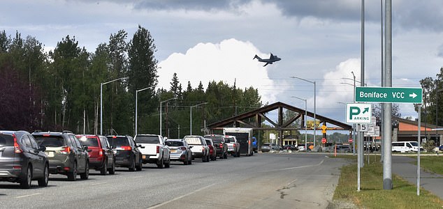 ANCHORAGE, ALASKA - AUGUST 14: Vehicles wait in line to enter the Joint Base Elmendorf-Richardson which will host a meeting of Russian President Vladimir Putin and U.S. President Donald Trump on August 14, 2025 in Anchorage, Alaska. (Photo by Sha Hanting/China News Service/VCG via Getty Images)