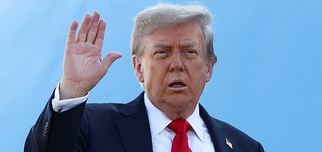 U.S. President Donald Trump waves while boarding Air Force One, as he departs for Alaska to meet with Russian President Vladimir Putin to negotiate for an end to the war in Ukraine, from Joint Base Andrews in Maryland, U.S., August 15, 2025. REUTERS/Kevin Lamarque