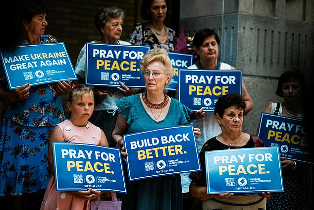 People attend a 'Rally for Peace', before U.S. President Donald Trump meets with Russian President Vladimir Putin in Alaska, at Saint George Ukrainian Catholic Church in New York City, U.S., August 15, 2025. REUTERS/Eduardo Munoz