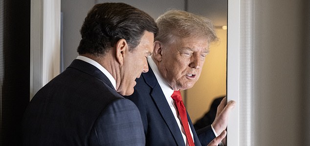US President Donald Trump stands next to US FOX News host, Bret Baier, after speaking to reporters aboard Air Force One in the air on August 15, 2025. US President Donald Trump departed Washington en route to Alaska Friday for a high-risk summit with his Russian counterpart Vladimir Putin that could prove decisive for the future of Ukraine. (Photo by ANDREW CABALLERO-REYNOLDS / AFP) (Photo by ANDREW CABALLERO-REYNOLDS/AFP via Getty Images)