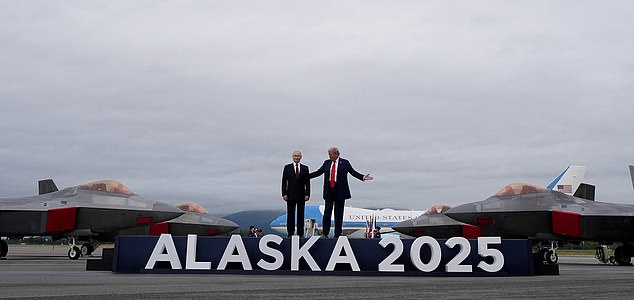 ANCHORAGE, ALASKA - AUGUST 15: U.S. President Donald Trump (R) welcomes Russian President Vladimir Putin as they arrives at Joint Base Elmendorf-Richardson on August 15, 2025 in Anchorage, Alaska. The two leaders are meeting for peace talks aimed at ending the war in Ukraine.  (Photo by Andrew Harnik/Getty Images)