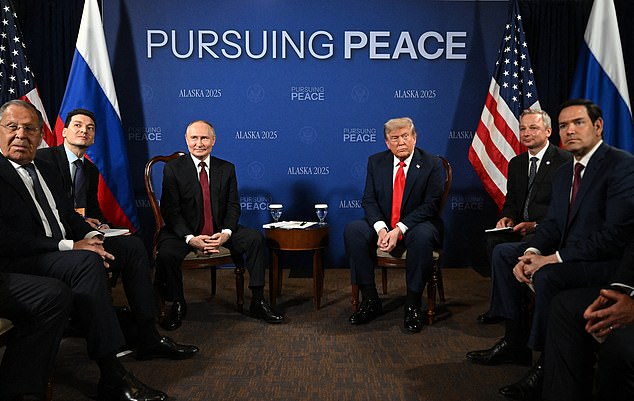 In this pool photograph distributed by the Russian state agency Sputnik, US President Donald Trump and Russian President Vladimir Putin meet during a US-Russia summit on Ukraine at Joint Base Elmendorf-Richardson in Anchorage, Alaska, on August 15, 2025. (Photo by Sergey Bobylev / POOL / AFP) (Photo by SERGEY BOBYLEV/POOL/AFP via Getty Images)
