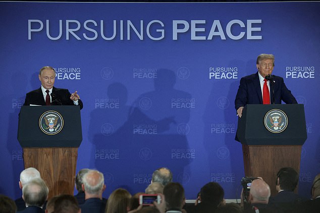 U.S. President Donald Trump and  Russian President Vladimir Putin hold a press conference following their meeting to negotiate an end to the war in Ukraine, at Joint Base Elmendorf-Richardson in Anchorage, Alaska, U.S., August 15, 2025. REUTERS/Jeenah Moon