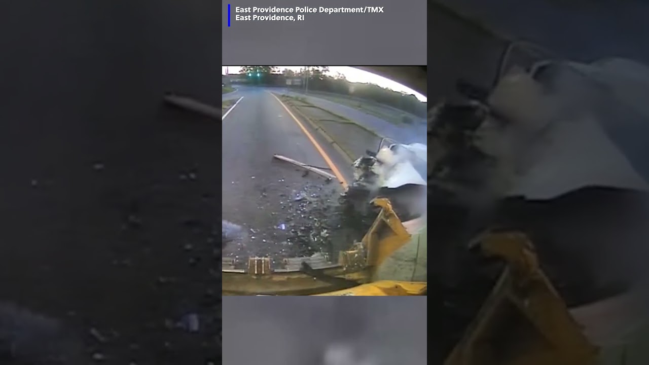 Video shows a car speeding down the road before slamming into the back of a trash truck