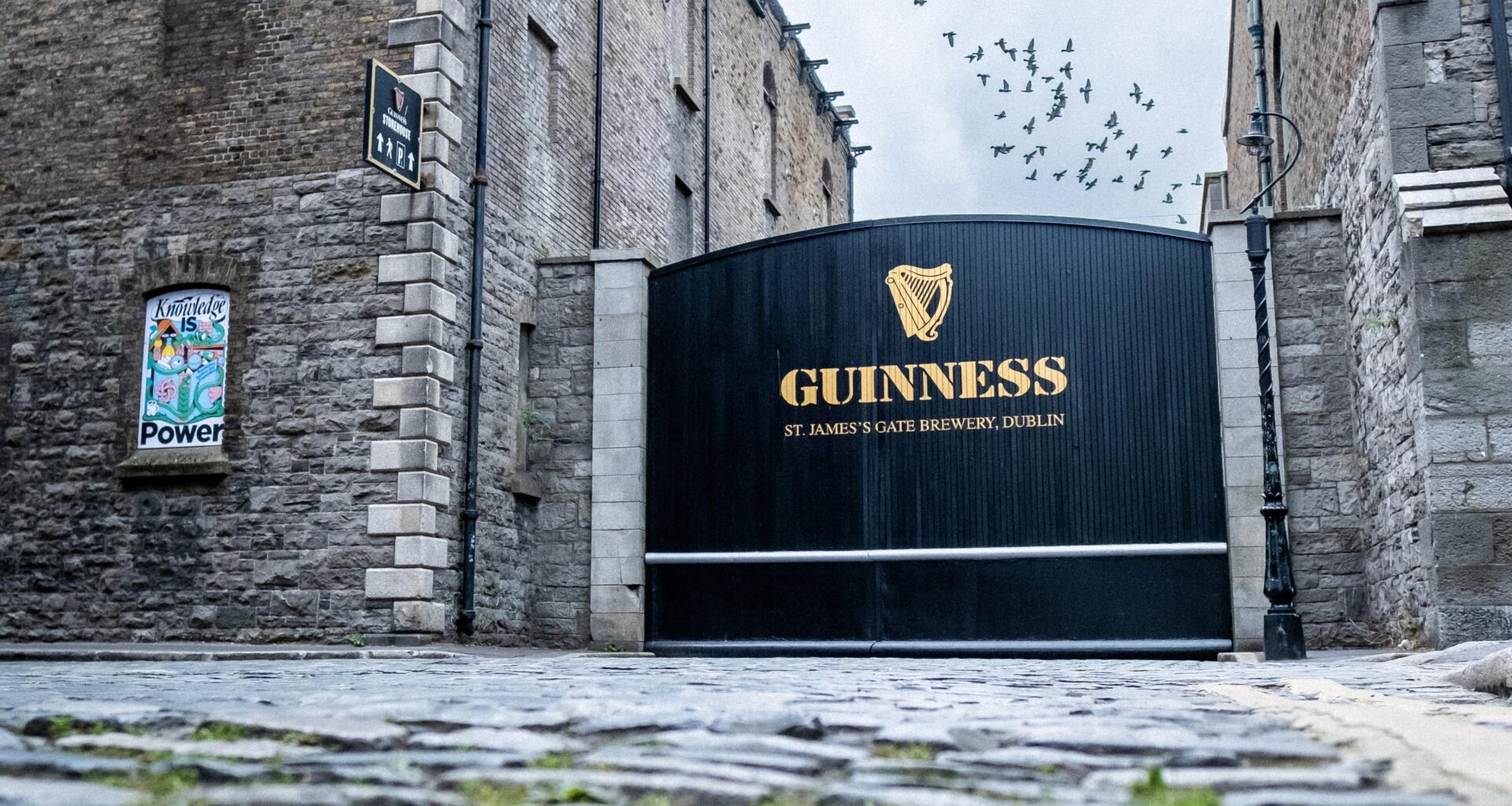 It took a bit of patience but nailed this shot with the flock of birds over the gate, no cars passing, and no tourists in frame. Taken last week while back home to visit family.