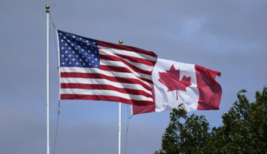 U.S. and Canadian flags fly together