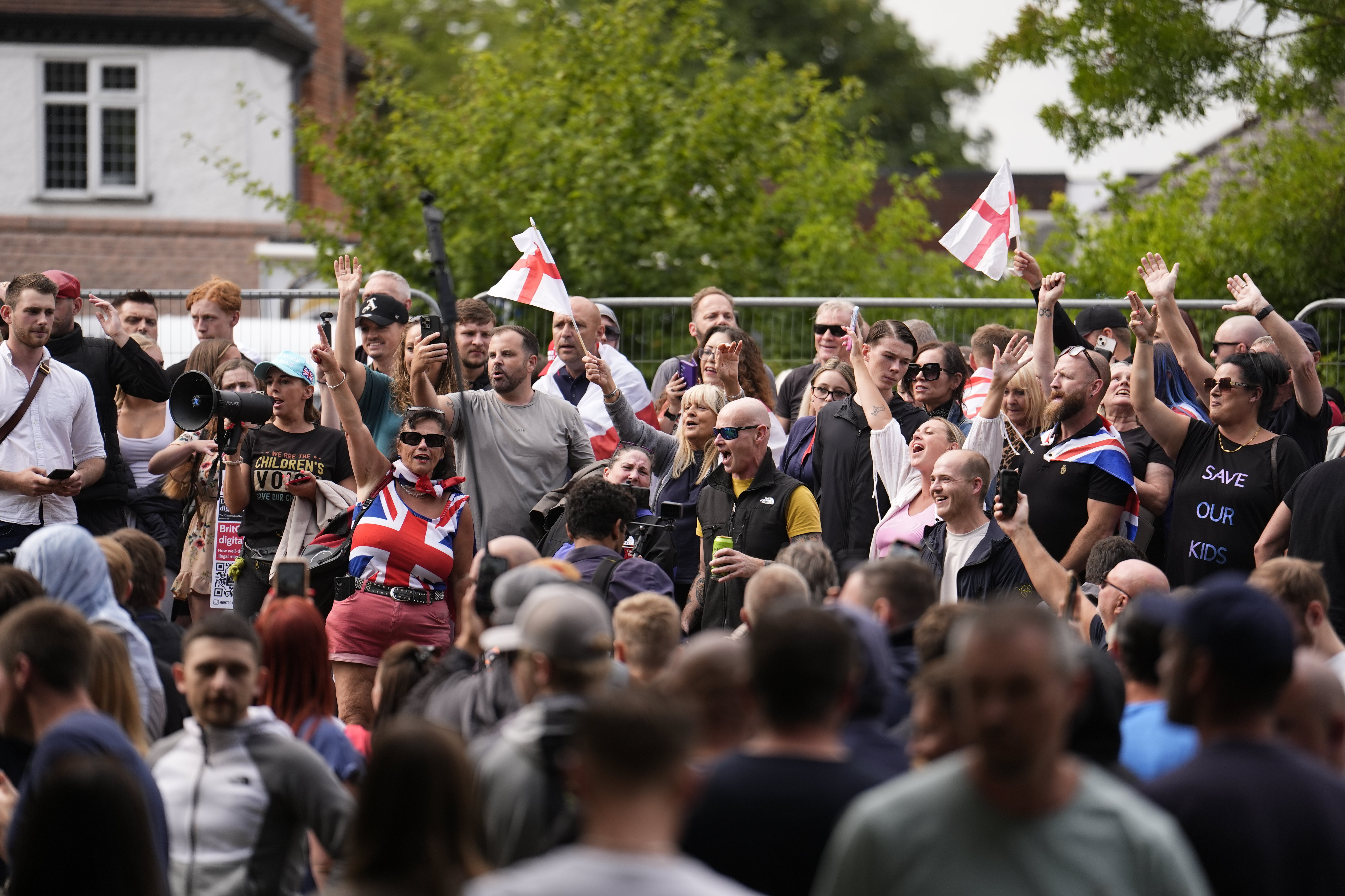 Protesters outside the Bell Hotel in July