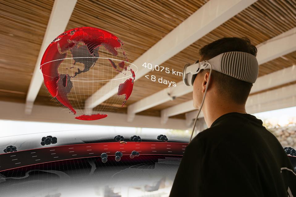 Man with a VR headset look at a globe with a white line around labelled 40,075km < 8 days