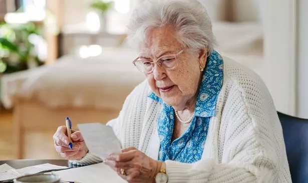 A woman checks her bills