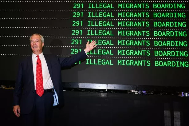 Nigel Farage posed in front of a mock passenger departures board after unveiling Reform's sweeping plans to deport hundreds of thousands of migrants