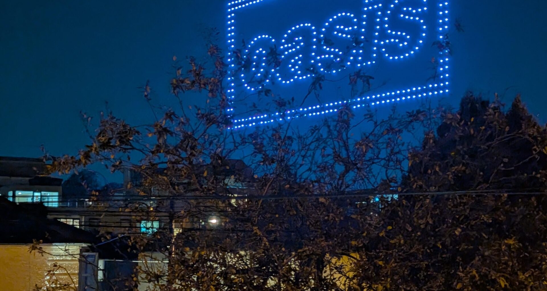 Giant Oasis drone sign