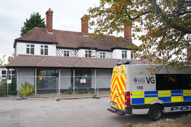 A police van outside the Bell Hotel in Epping, Essex