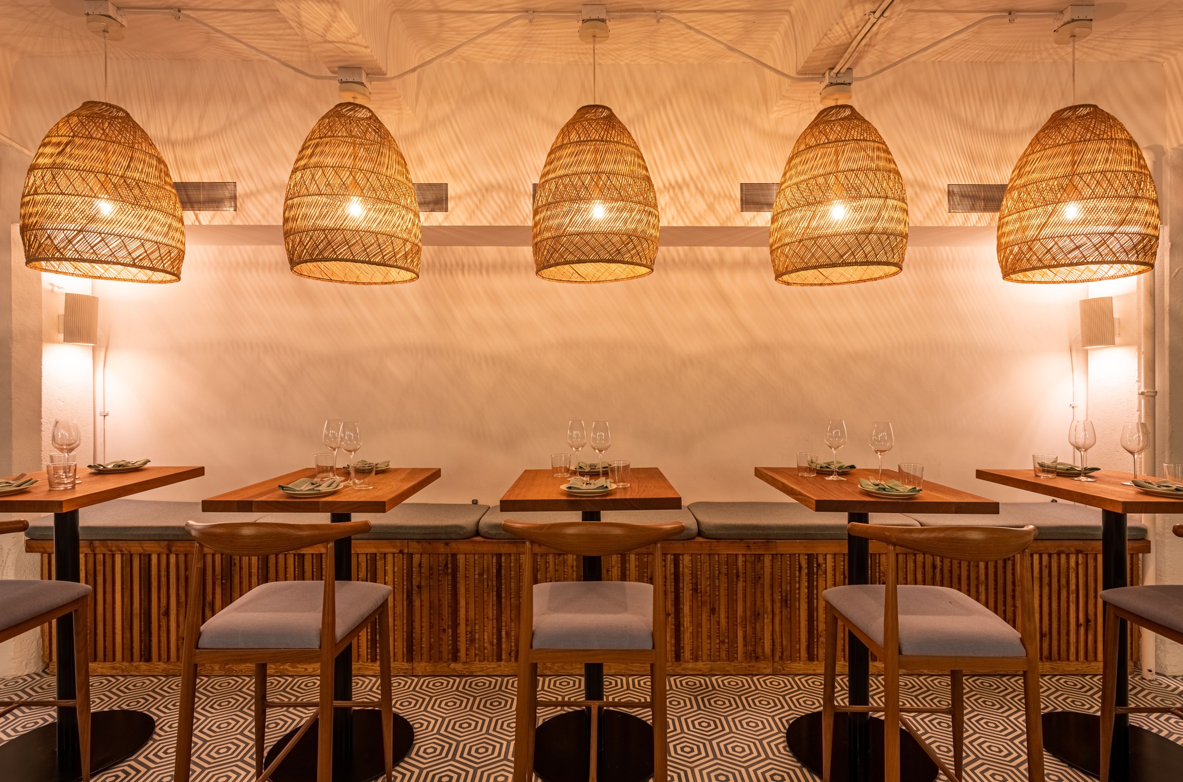 Indoor dining area with hanging lamps.