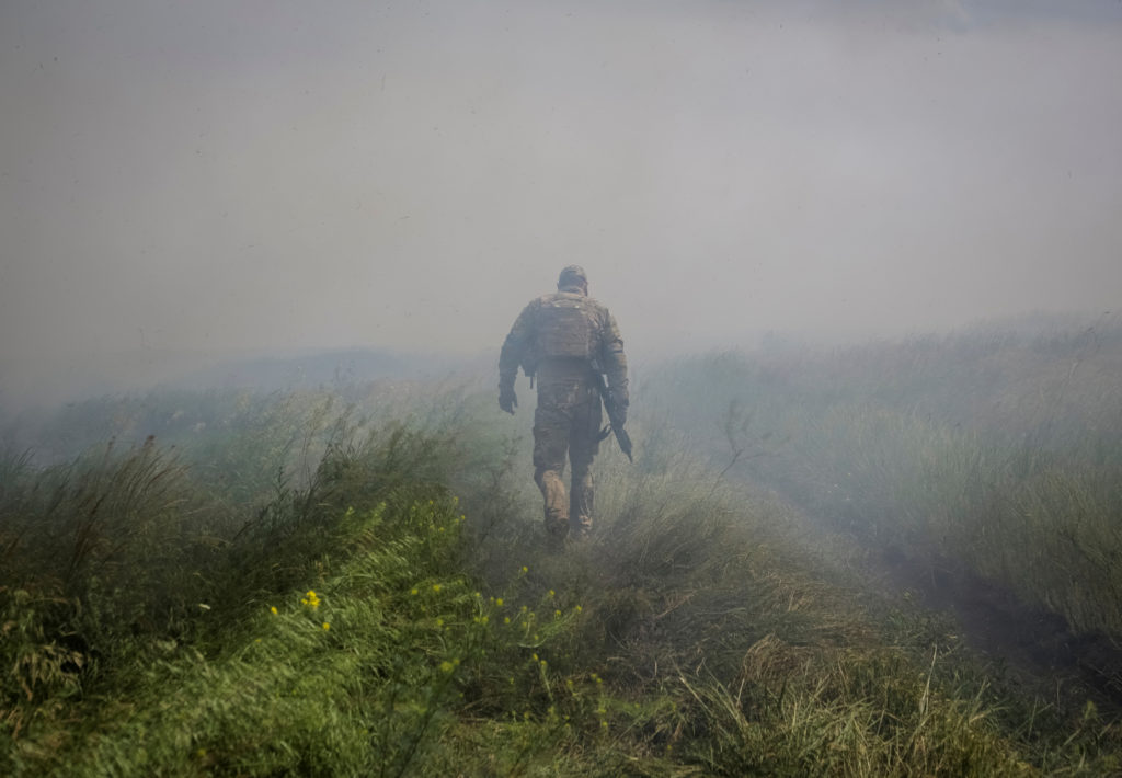 A Ukrainian service member is seen near the front line near the newly liberated village Neskuchne