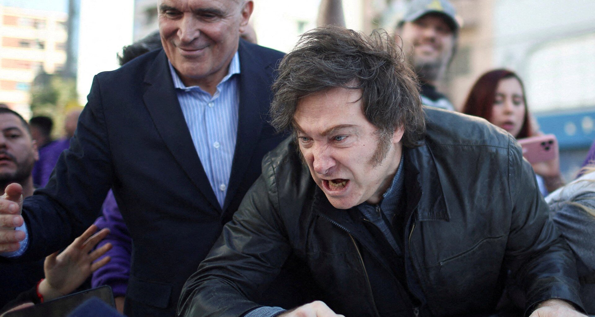 Argentinian President Javier Milei leaves rally after protesters throw rocks | Protests News