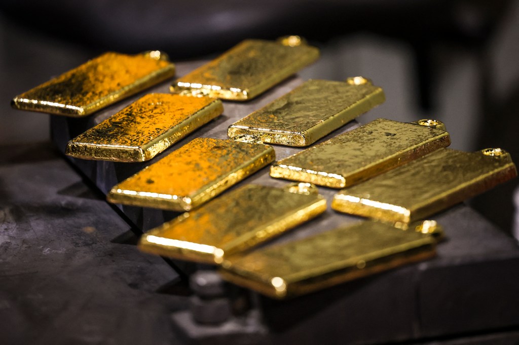 Several gold bars at a refinery.