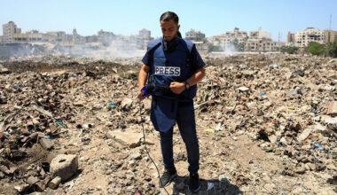 Al Jazeera journalist Anas Al Sharif, who was killed in an Israeli strike on August 10, 2025, stands at a landfill as he reports the news in Gaza City August 13, 2024