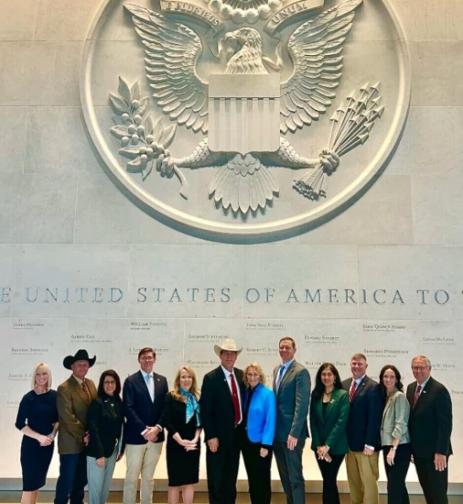 A trade mission led by Gov. Larry Rhoden hopes to expand opportunities for ethanol, beef and other businesses in the United Kingdom and Ireland. The delegation poses for a photo at the U.S. embassy in London.