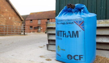 A sack of ammonium nitrate fertilizer in the yard of a dairy farm